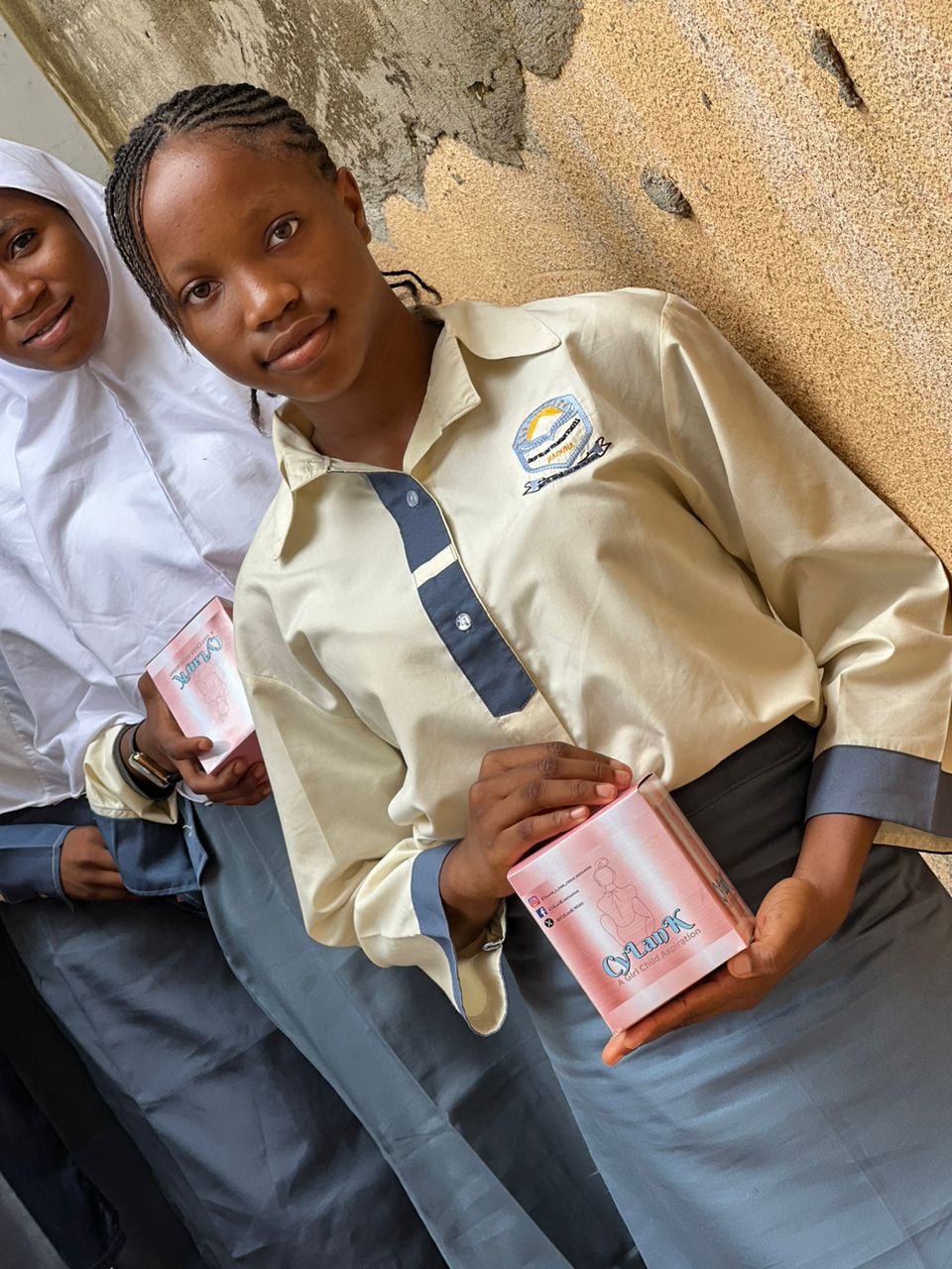 A student holding a CyLanK pad box